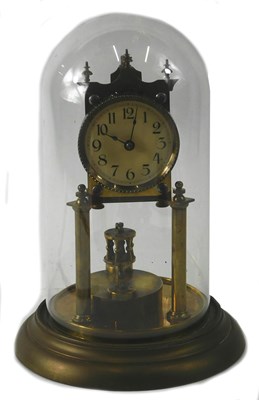 Lot 142 - A brass anniversary clock, the paper dial with...
