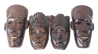 Lot 143 - A collection of African tribal hardwood...