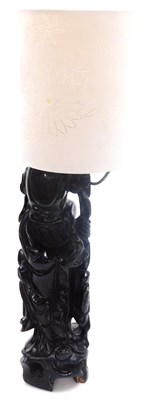 Lot 62 - A Chinese hardwood table lamp modelled as...