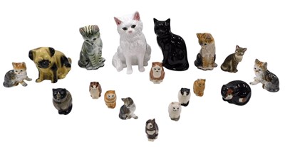 Lot 652B - A group of ceramic cat figures, to include...