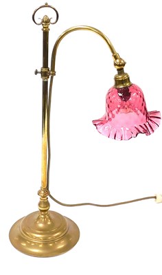 Lot 49 - An early 20thC brass oil table lamp, converted...