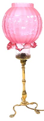 Lot 51 - An early 20thC brass table lamp, with a...