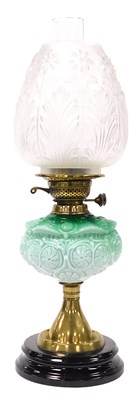 Lot 54 - A late 19thC brass oil lamp, with a pale green...