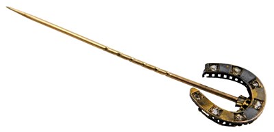 Lot 219 - A Victorian paste set horseshoe tie pin, in...