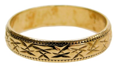 Lot 218 - A 9ct gold wedding band, with engraved...