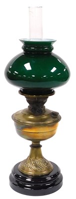 Lot 56 - An early 20thC brass oil lamp, with a glass...