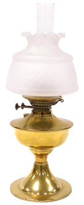 Lot 83 - An early 20thC brass oil lamp, with a glass...