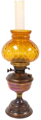 Lot 86 - An early 20thC copper oil lamp, with a glass...