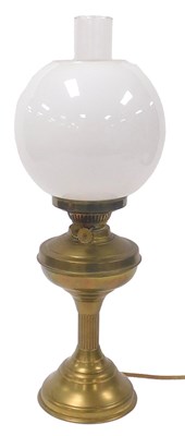 Lot 93 - An early 20thC brass oil lamp, converted to...