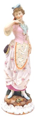 Lot 95 - A late 19thC French porcelain figure of a lady,...
