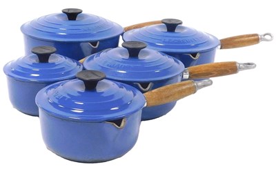 Lot 141 - Five Le Creuset blue enamel graduated...