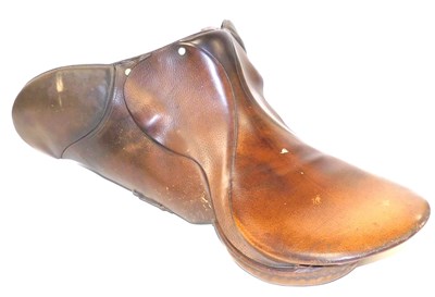 Lot 244 - A tan leather saddle, 69cm deep.