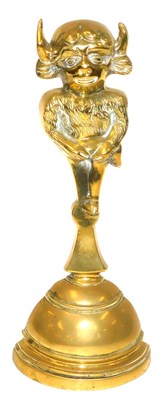 Lot 297 - An early 20thC brass and cast iron doorstop,...