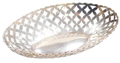 Lot 508 - A George V silver oval basket, of pierced form,...