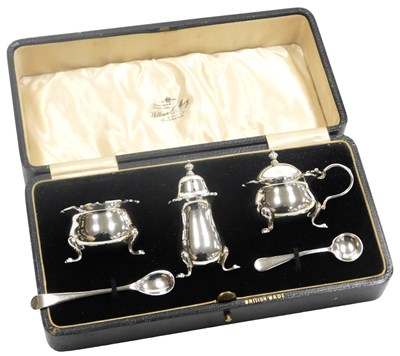 Lot 516 - A George V silver three piece condiment set,...