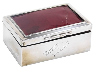 Lot 519 - A silver and red guilloche enamel cigarette...