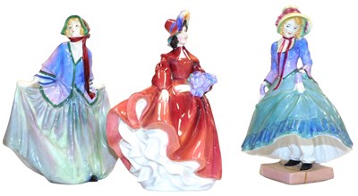 Lot 389 - Three Royal Doulton figures, comprising...