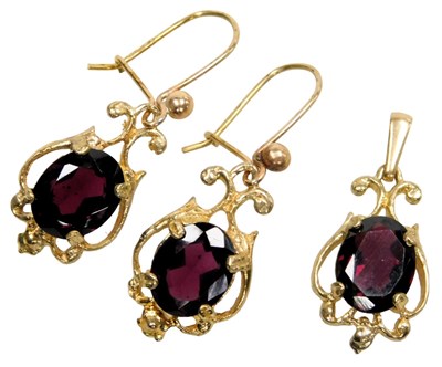 Lot 402 - A 9ct gold and garnet set pendant, together...