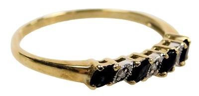 Lot 404 - A 9ct gold and sapphire four stone ring, set...
