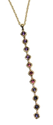 Lot 407 - A 9ct gold and nine stone drop pendant, set...