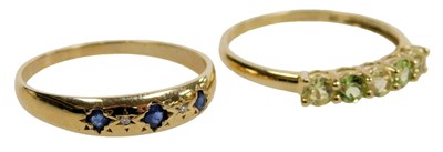 Lot 413 - A 9ct gold and sapphire three stone ring, set...