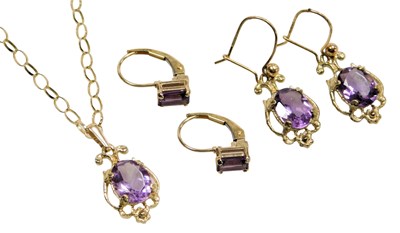 Lot 414 - A 9ct gold and amethyst pendant, on a 9ct gold...