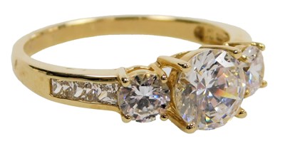 Lot 416 - A 15ct gold and cz three stone ring, with cz...
