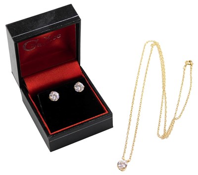 Lot 418 - A 14ct gold and cz solitaire pendant, together...