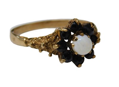 Lot 55 - A 9ct gold sapphire and opal floral cluster...