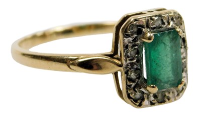 Lot 427 - A 9ct gold emerald and diamond ring, the...