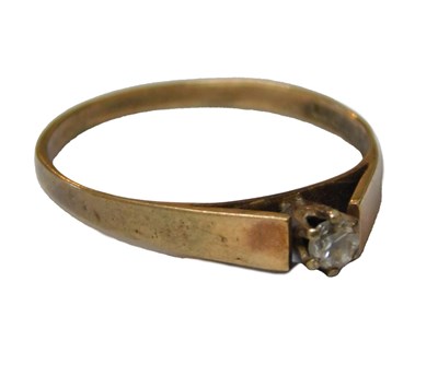 Lot 61 - A 9ct gold and CZ ring, the high claw set, on...