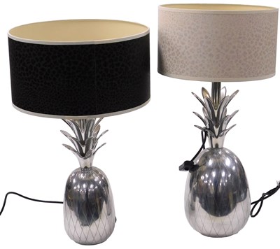 Lot 437 - Two graduated white metal table lamps, formed...