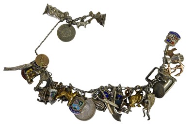 Lot 70 - A charm bracelet, with five charms as fitted,...