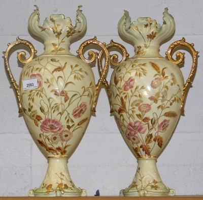 Lot 2083 - A pair of TBB&R ceramic twin handled vases,...