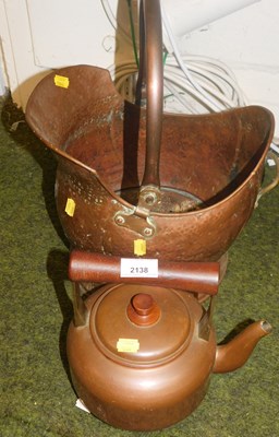 Lot 2138 - A hammered copper helmet shaped coal scuttle,...