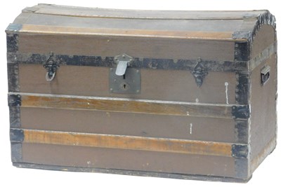 Lot 444 - An early 20thC domed canvas trunk, wooden and...