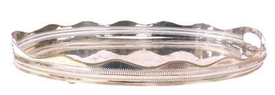 Lot 449 - A silver plated oval twin handled galleried...