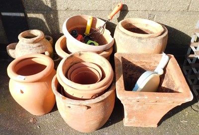 Lot 1013 - A group of terracotta and other plant pots,...