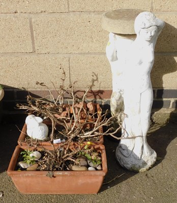 Lot 1018 - Three terracotta plant pots, each of...