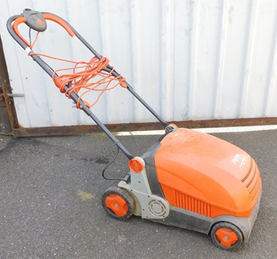 Lot 1025 - A Flymo lawn rake compact 3400 electric mower.