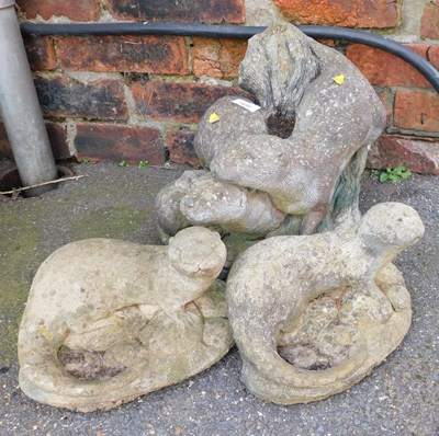 Lot 1038 - Three composition stone garden sculptures,...