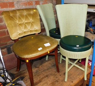 Lot 1042 - A pair of green painted Lloyd Loom chairs,...
