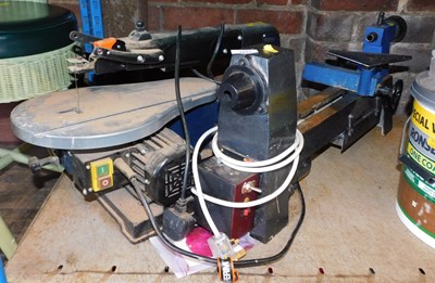 Lot 1045 - A Ferm fret saw, together with a lathe.