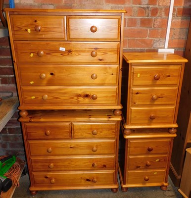 Lot 1057 - A pine bedroom suite, comprising a pair of...