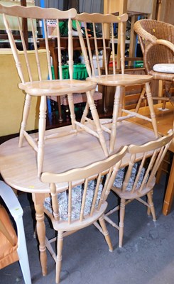 Lot 1064 - An oak veneer kitchen table, the rectangular...