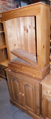 Lot 1067 - A pine two door cabinet, with a raised back,...