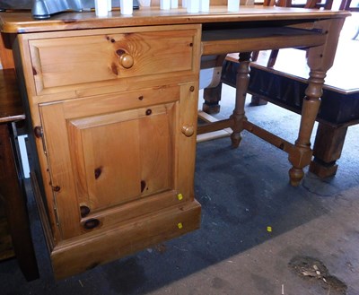 Lot 1072 - A pine desk, rectangular top with a rounded...