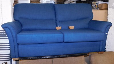 Lot 1075 - An Ideal Upholstery two seater sofa, in blue...
