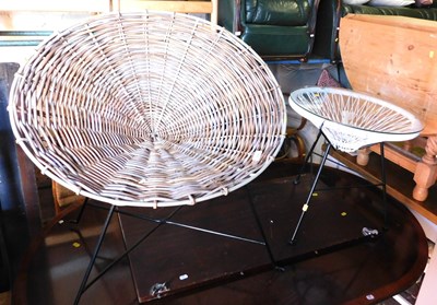 Lot 1090 - A wicker chair, on black painted metal support,...