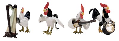 Lot 486 - Four Klima rooster band figures, comprising a...